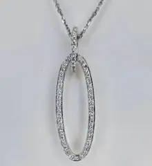 Diamond pendant with an open oval silhouette